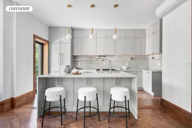 a living room with furniture and large windows