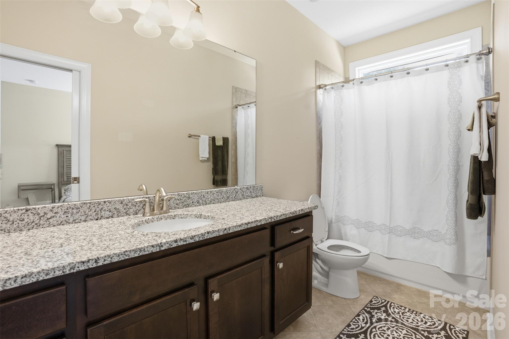 14022 Salem Ridge Road Huntersville, NC 28078 - Photo 27 of 38 a bathroom with a granite countertop sink toilet and shower