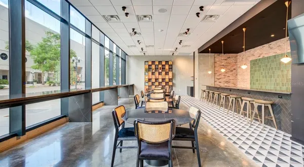a view of a dining room with furniture window and outside view