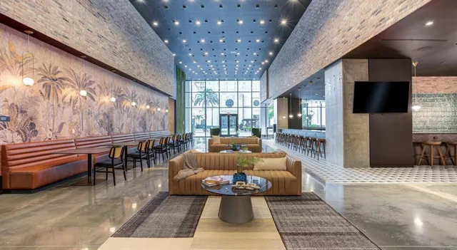 a outdoor living space with furniture and a flat screen tv