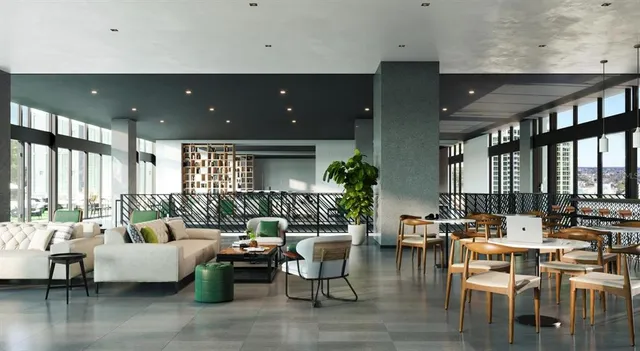 a living room with lots of furniture and a large window