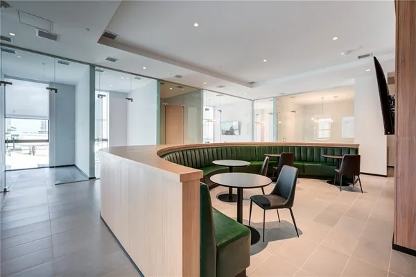 a kitchen with a table and chairs in it