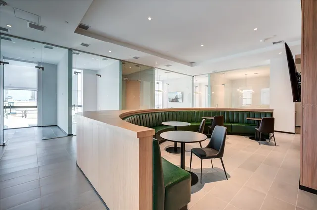 a kitchen with a table and chairs in it