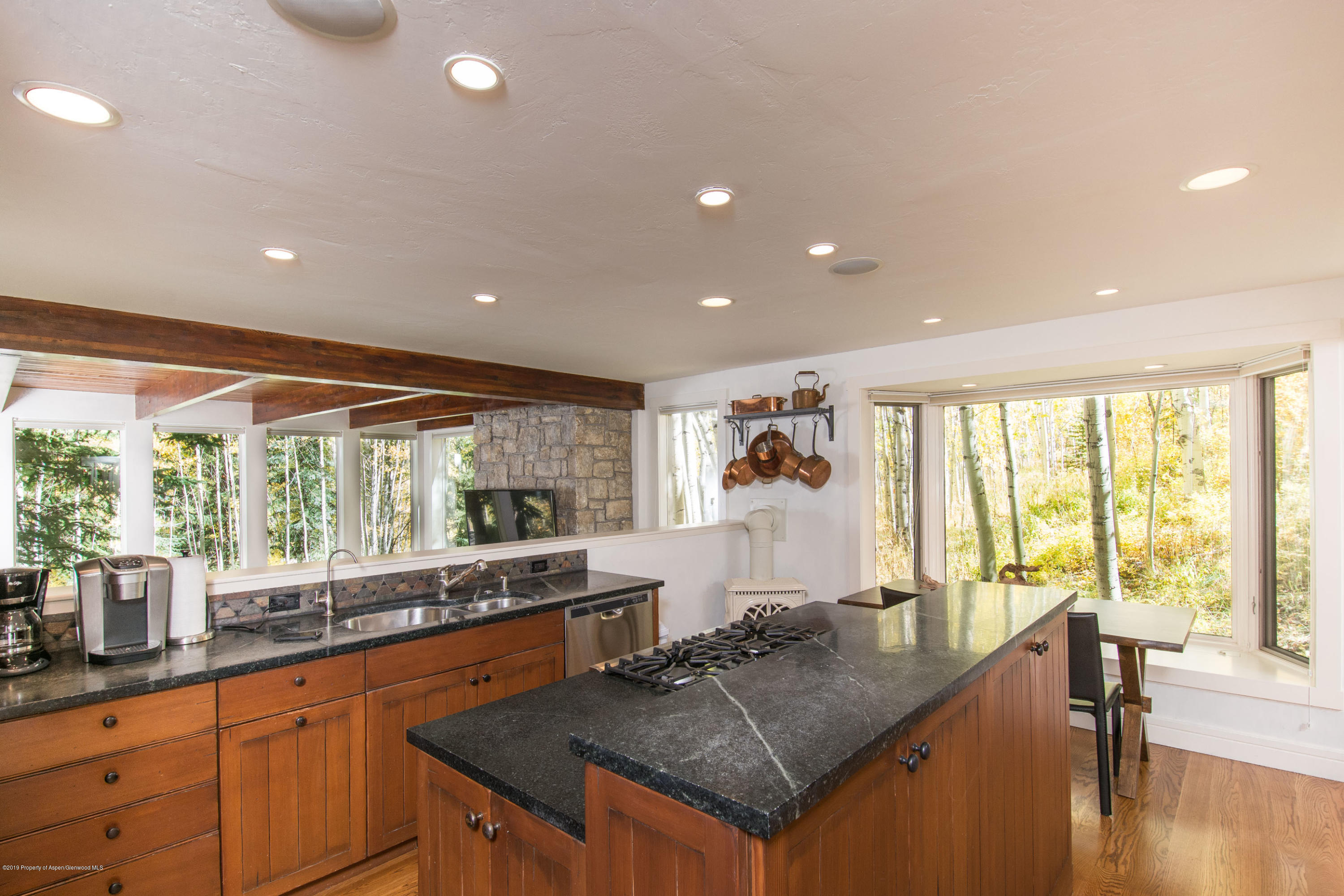 623 Faraway Road Snowmass Village, CO 81615 - Photo 4 of 30 a kitchen with large windows in it