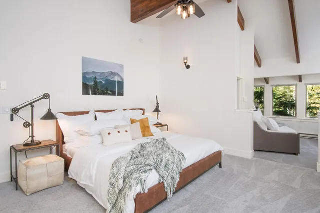 a bedroom with bed and window