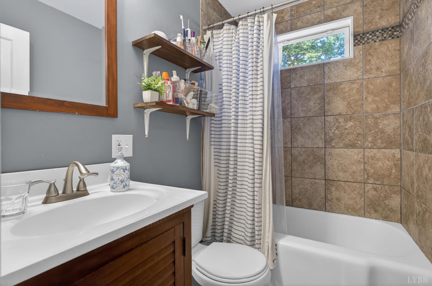 1305 Harding Street Lynchburg, VA 24502 - Photo 8 of 33 a bathroom with a sink toilet and shower