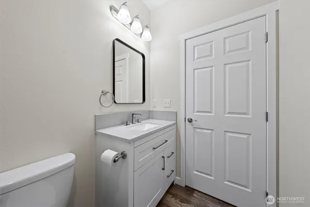 a view of a livingroom with a refrigerator