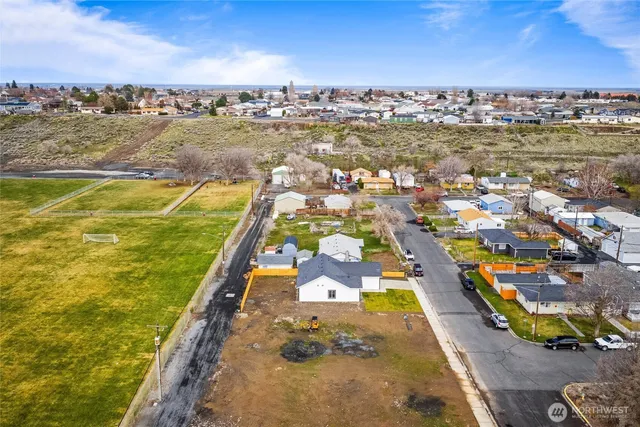 an aerial view of residential houses with outdoor space