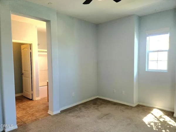 a view of empty room with windows