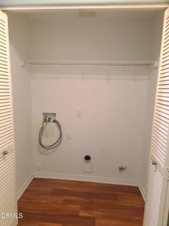 a bathroom with a granite countertop shower and a toilet