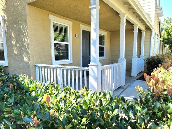 front view of a house with a flower garden
