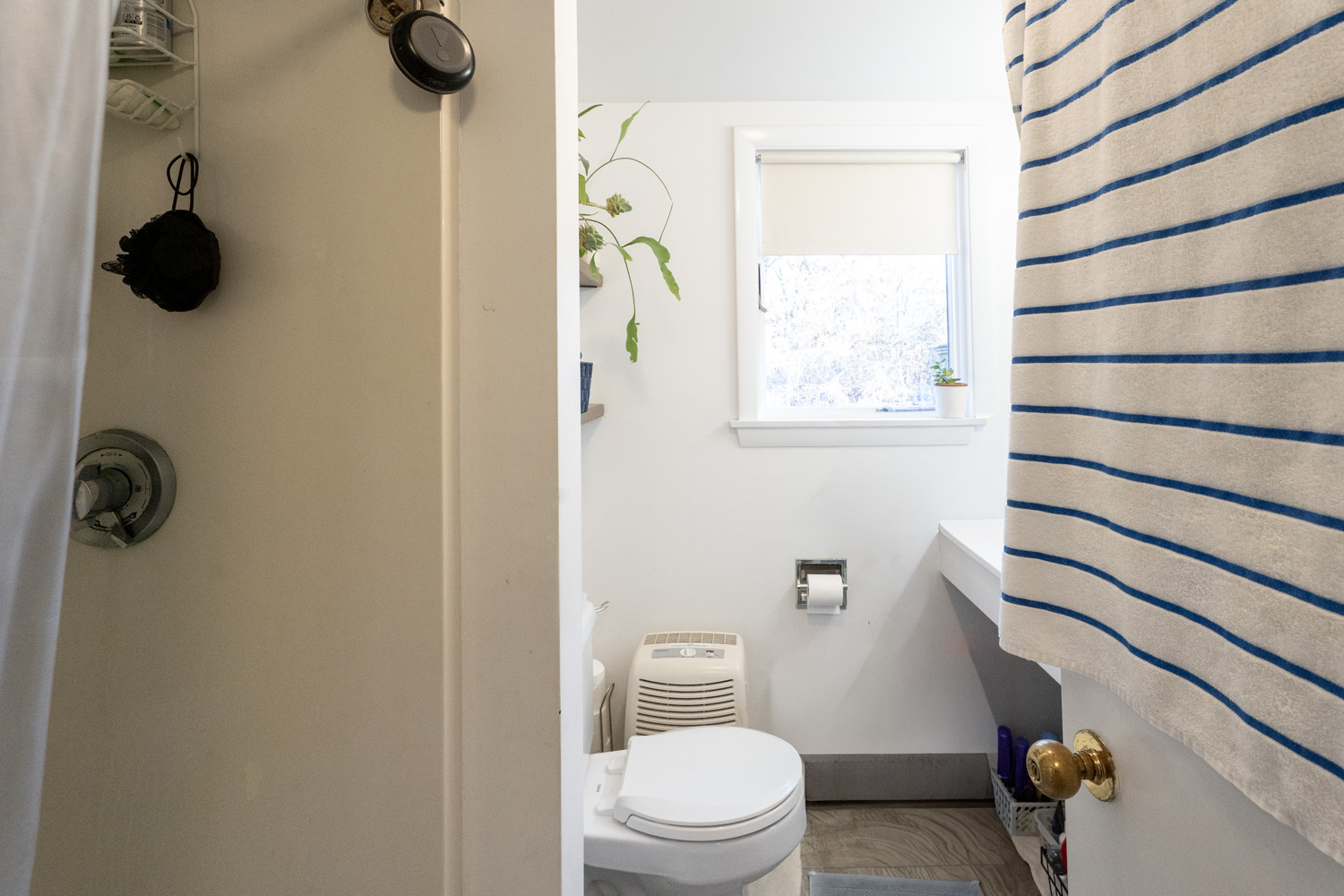 45 Quenames Road Chilmark, MA 02535 - Photo 5 of 10 a bathroom with a toilet and a window