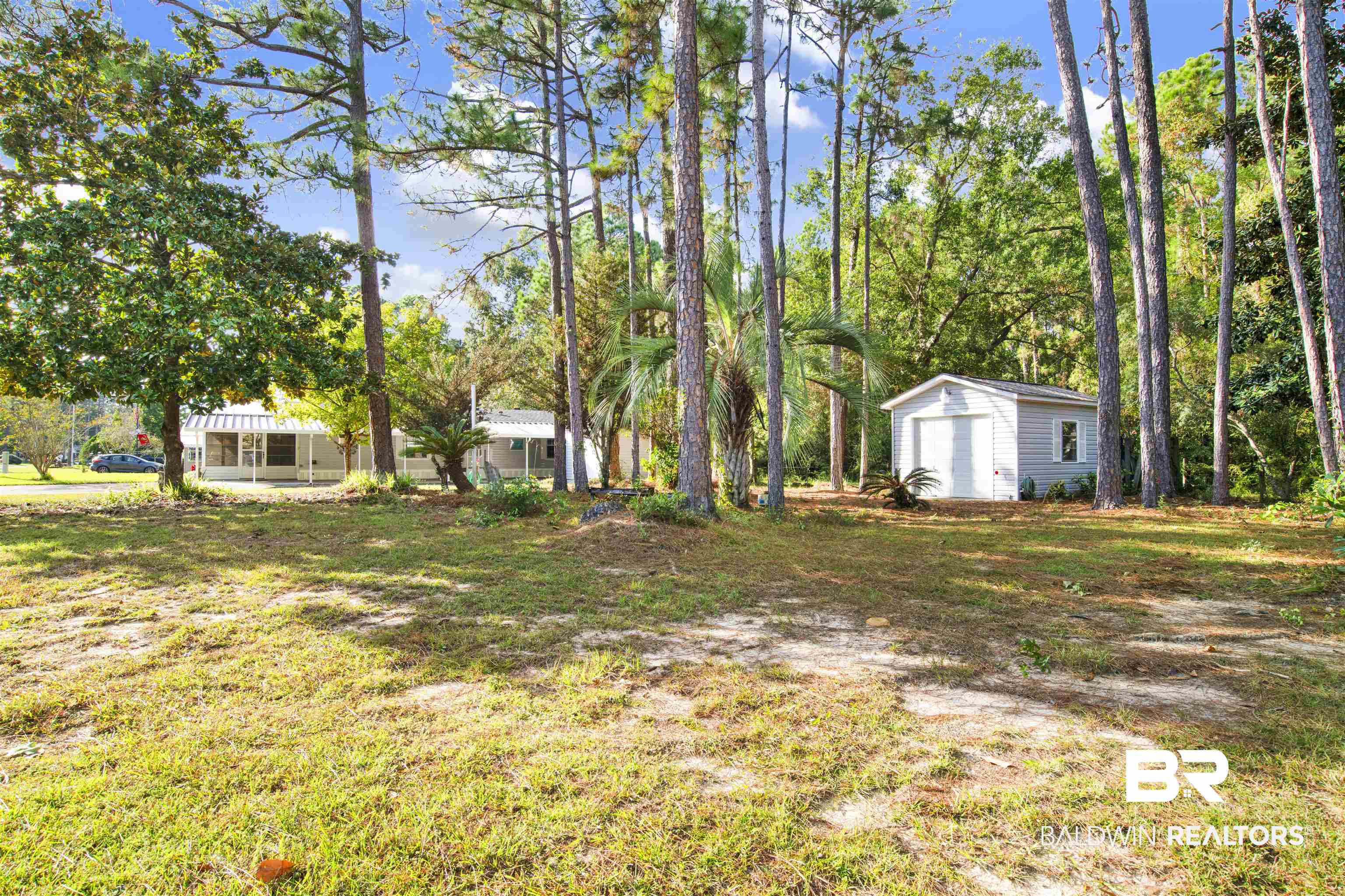 1216 Ridgewood Drive Lillian, AL 36549 - Photo 19 of 29 View of yard with an outbuilding