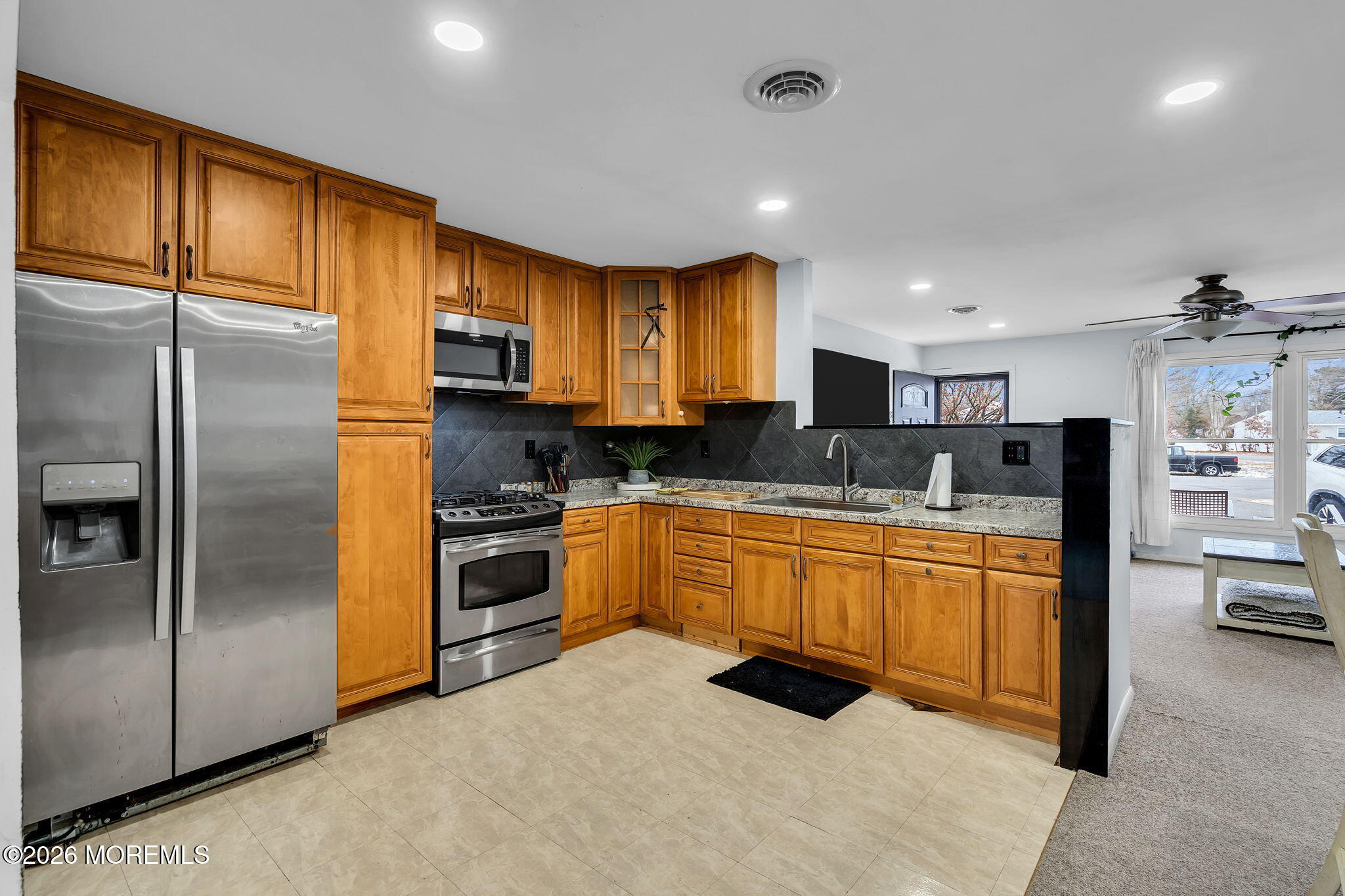 405 Decker Court Lanoka Harbor, NJ 08734 - Photo 13 of 21 a kitchen with stainless steel appliances granite countertop a refrigerator a stove and a sink with large countertops