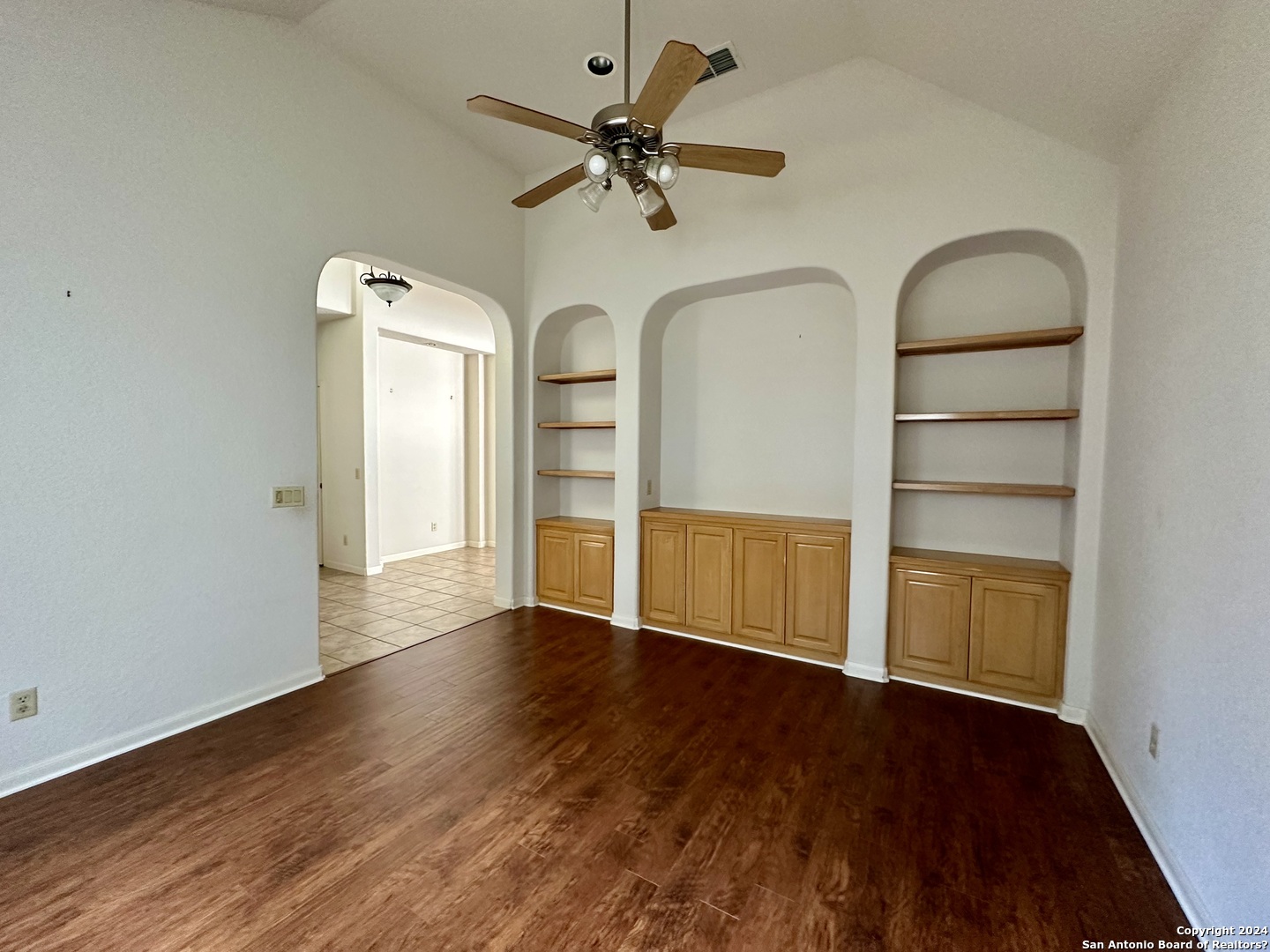 23107 Osprey Ridge San Antonio, TX 78258 - Photo 14 of 28 an empty room with wooden floor closet and windows