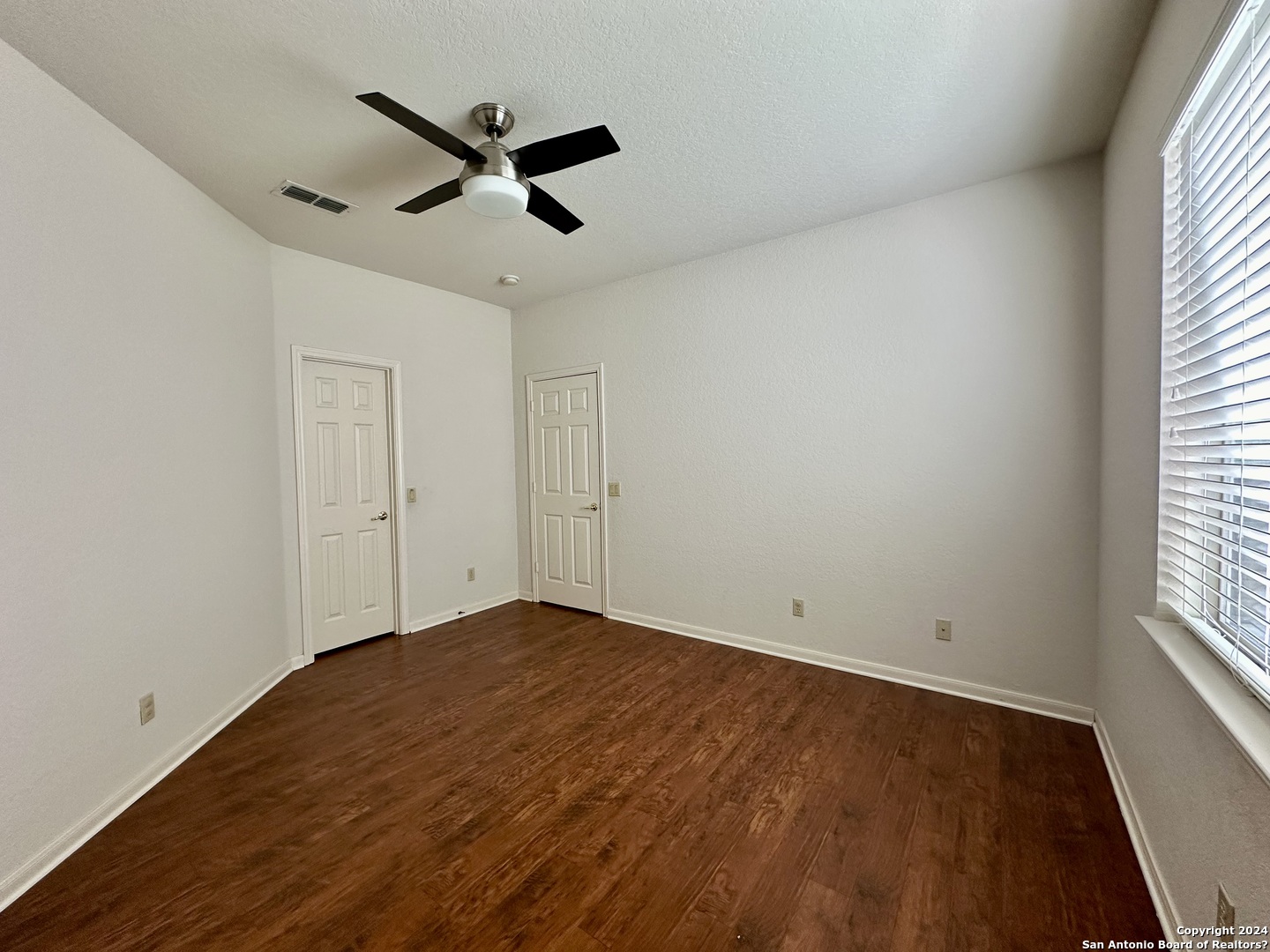 23107 Osprey Ridge San Antonio, TX 78258 - Photo 15 of 28 wooden floor in an empty room with a window