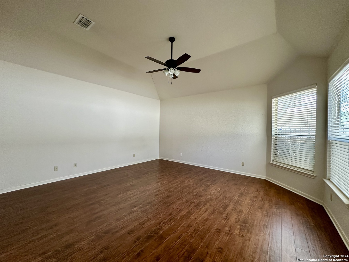23107 Osprey Ridge San Antonio, TX 78258 - Photo 18 of 28 wooden floor in an empty room with a window