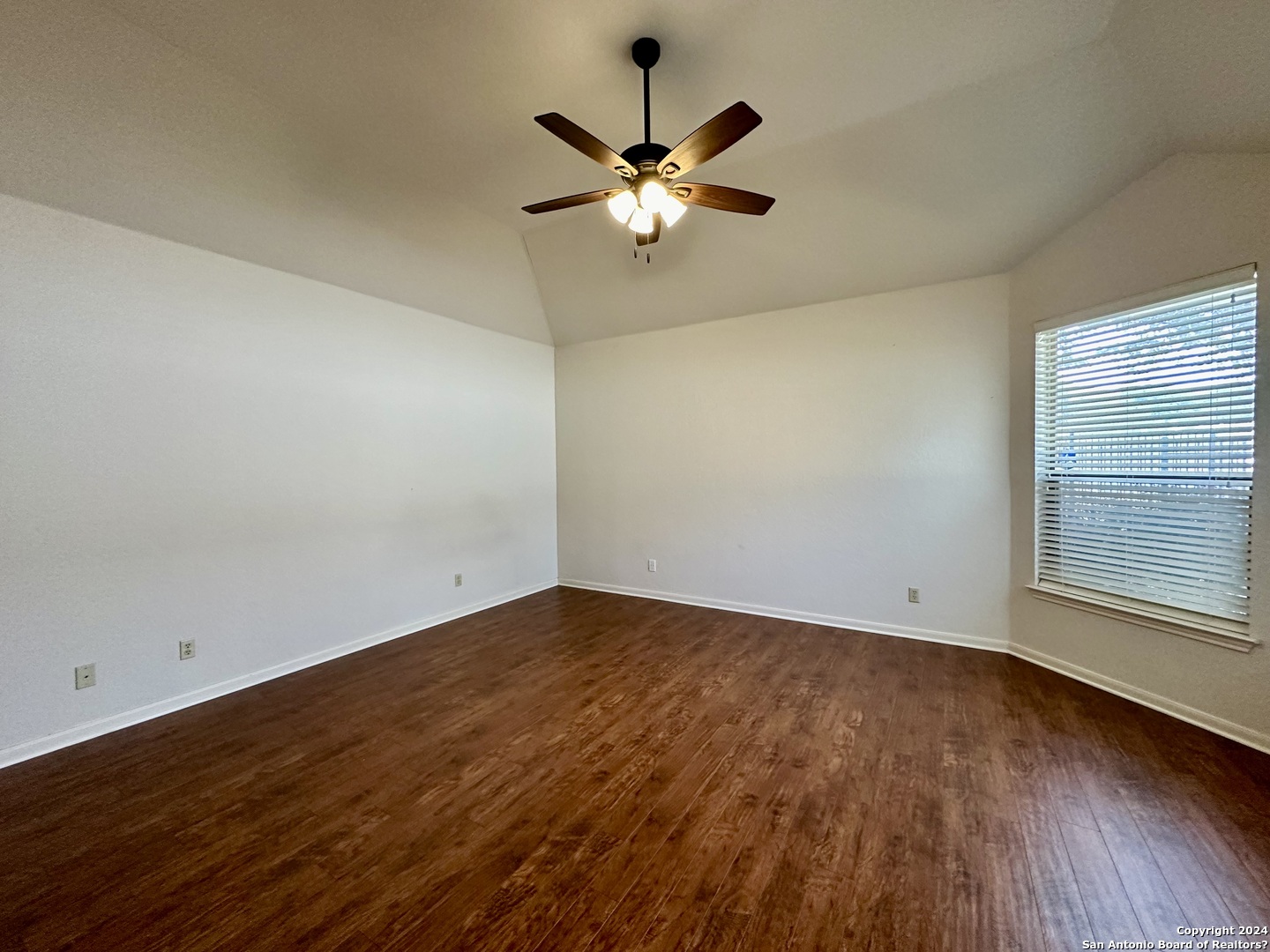 23107 Osprey Ridge San Antonio, TX 78258 - Photo 19 of 28 wooden floor in an empty room with a window