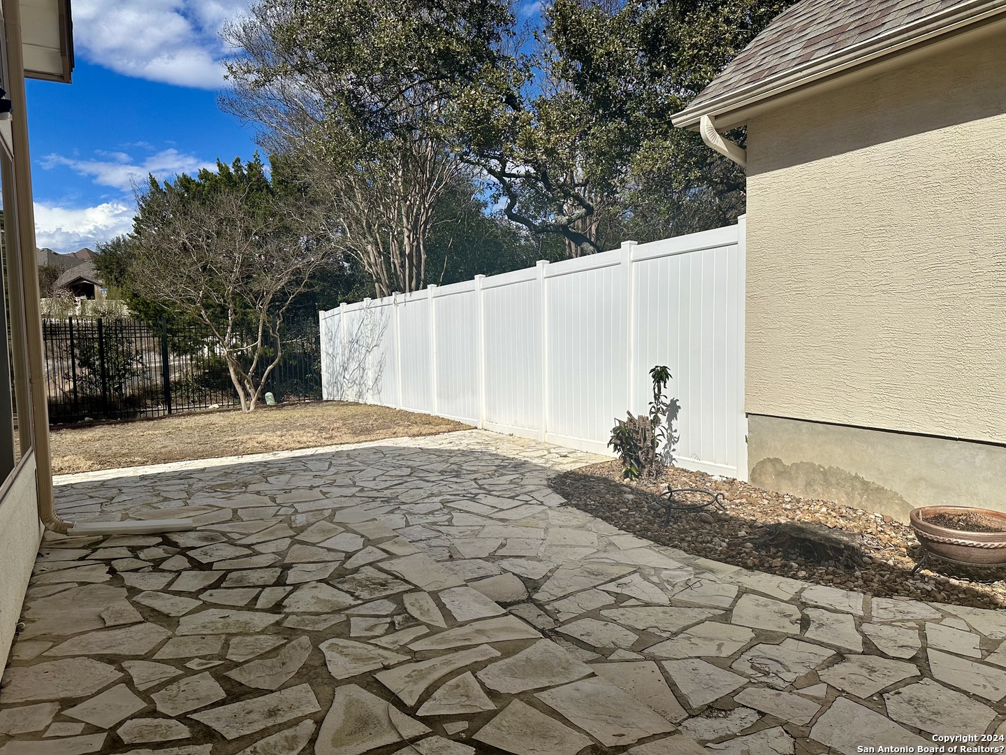 23107 Osprey Ridge San Antonio, TX 78258 - Photo 26 of 28 a view of a backyard of the house