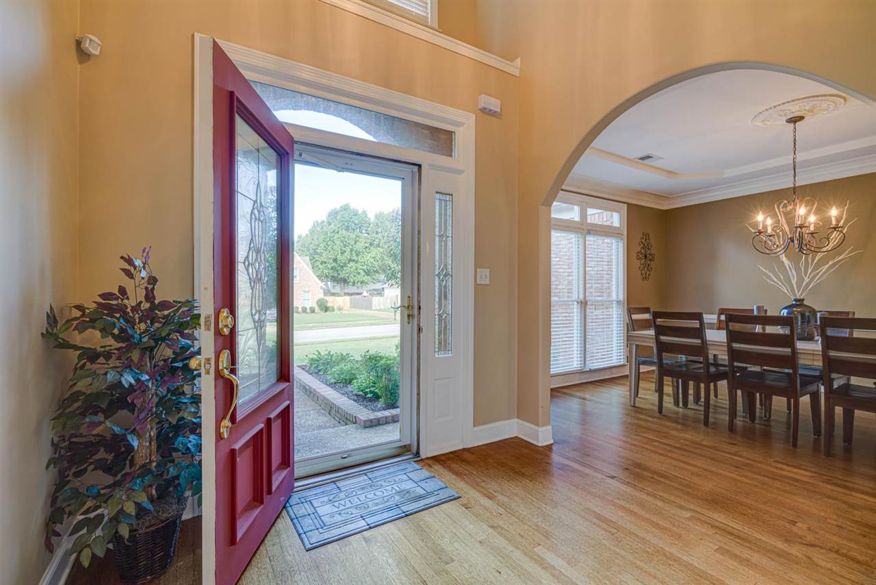 1344 Wahkin Road Collierville, TN 38017 - Photo 2 of 25 a view of a dining room with furniture and wooden floor