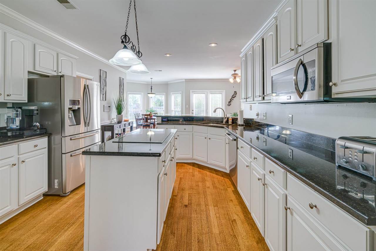 1344 Wahkin Road Collierville, TN 38017 - Photo 12 of 25 a kitchen with stainless steel appliances granite countertop a sink a stove a refrigerator cabinets and a kitchen island