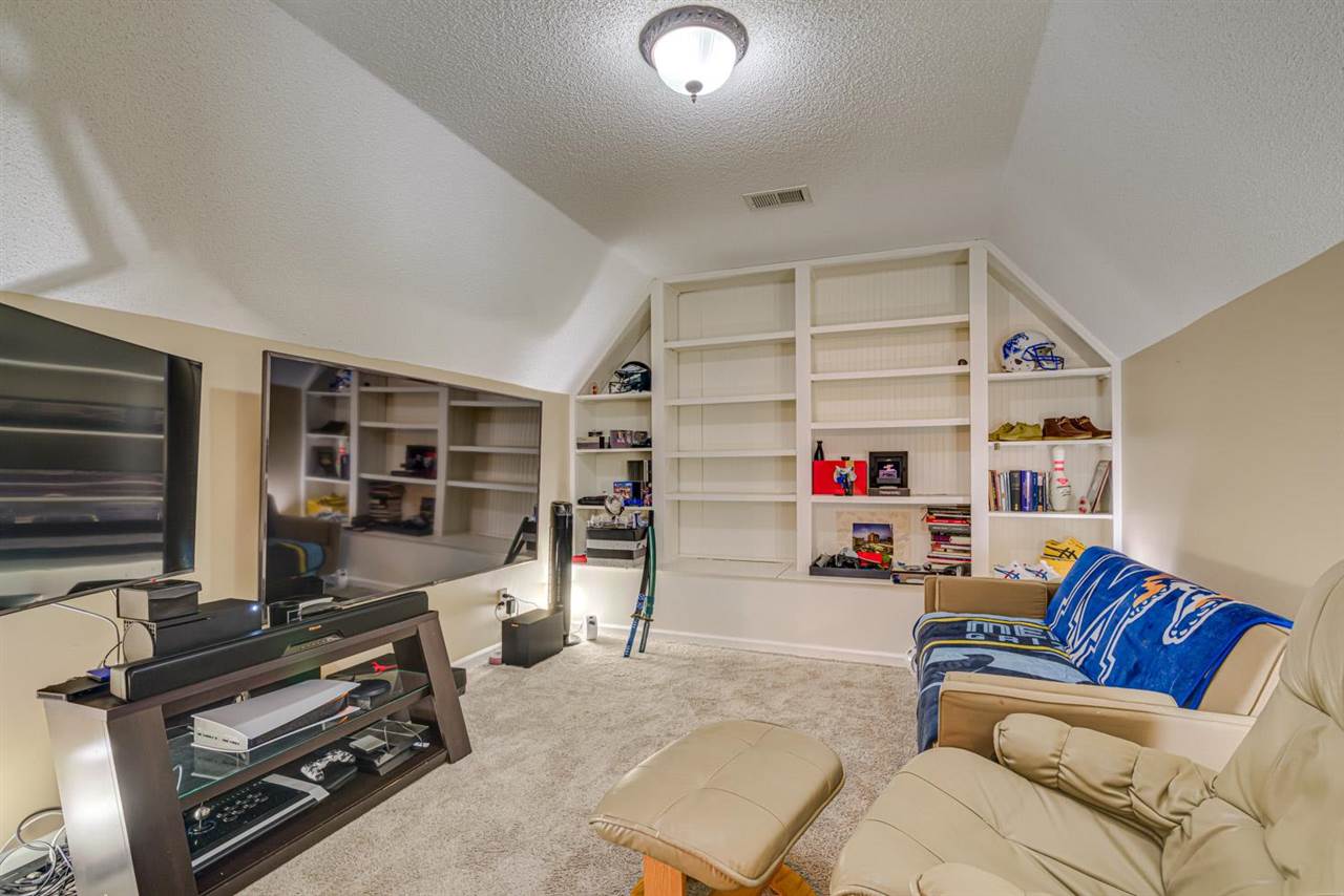 1344 Wahkin Road Collierville, TN 38017 - Photo 20 of 25 a living room with furniture and a flat screen tv