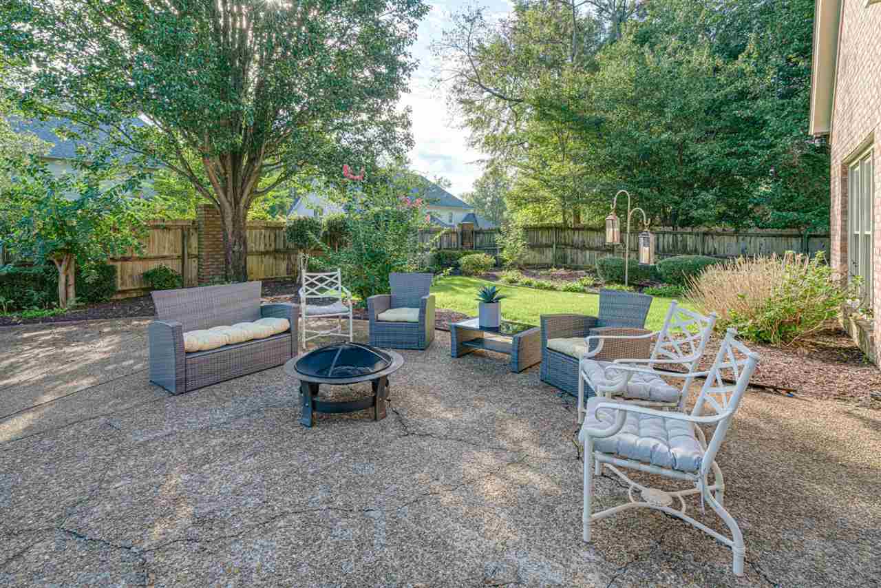 1344 Wahkin Road Collierville, TN 38017 - Photo 22 of 25 a backyard of a house with table and chairs