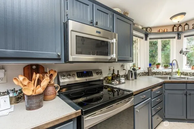 a kitchen with a stove and a microwave