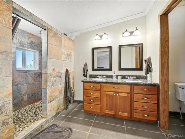 a view of a room with gym equipment and a view of living room