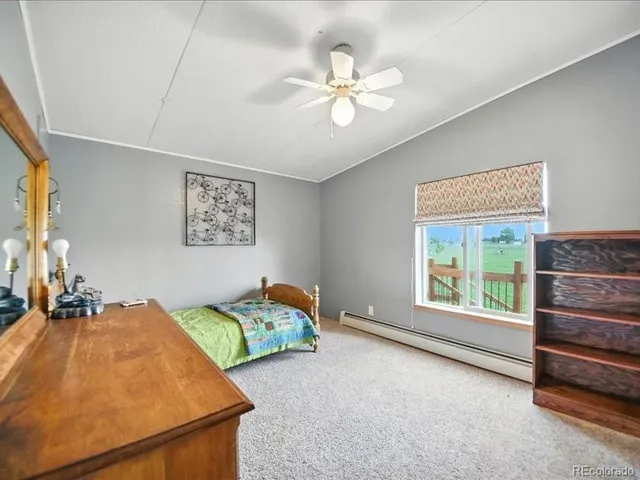 a kitchen with stainless steel appliances granite countertop a kitchen island hardwood floor sink stove dining table and chairs