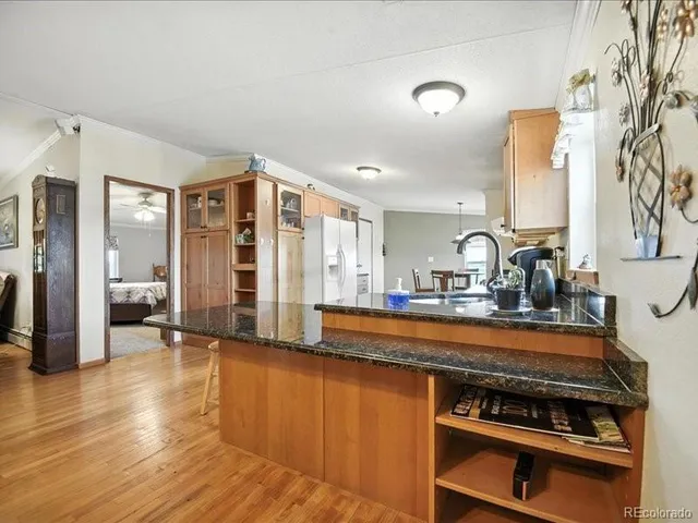 a living room with furniture a flat screen tv and a large window