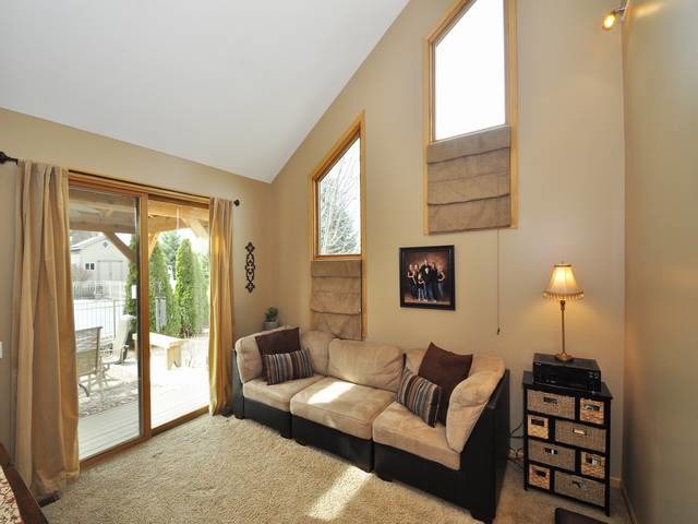 1603 Beech Street Spring Grove, IL 60081 - Photo 11 of 24 a living room with furniture and a lamp