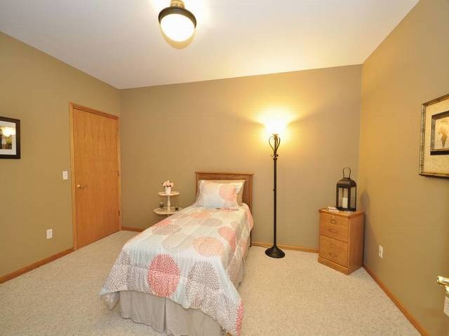 1603 Beech Street Spring Grove, IL 60081 - Photo 16 of 24 a bedroom with a bed and lamp on desk