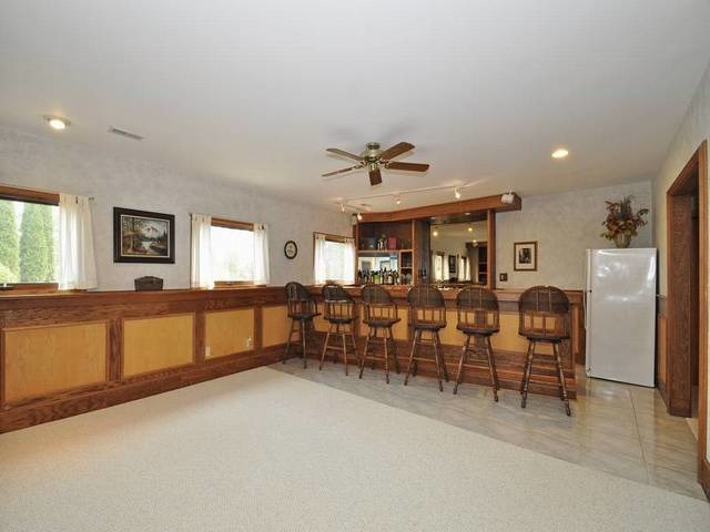 1603 Beech Street Spring Grove, IL 60081 - Photo 19 of 24 a view of a livingroom with furniture and windows