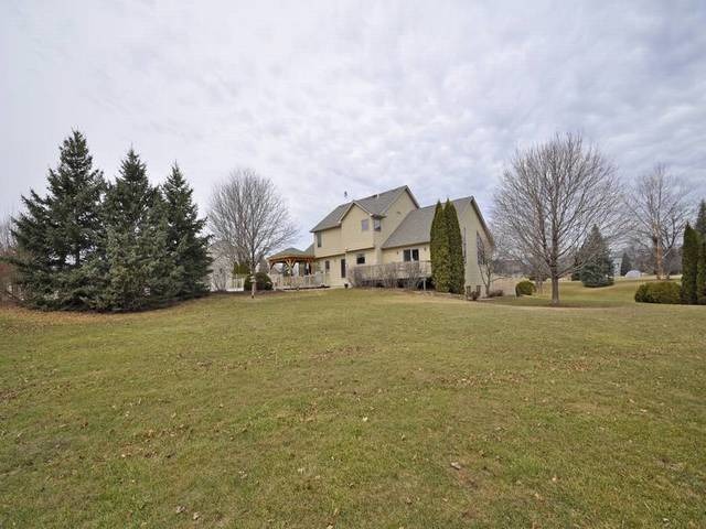 1603 Beech Street Spring Grove, IL 60081 - Photo 21 of 24 a house with trees in front of it