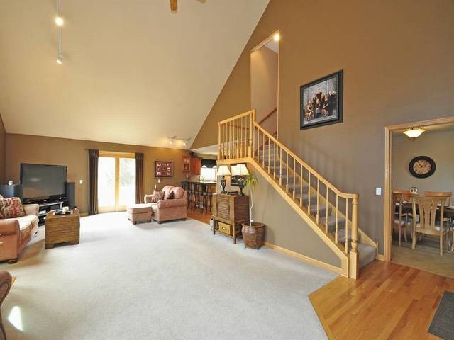 1603 Beech Street Spring Grove, IL 60081 - Photo 4 of 24 a view of a livingroom with furniture staircase and a living room