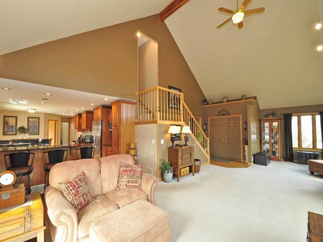 1603 Beech Street Spring Grove, IL 60081 - Photo 5 of 24 a view of a livingroom with furniture and a ceiling fan