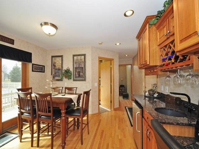 1603 Beech Street Spring Grove, IL 60081 - Photo 10 of 24 a view of a dining room with furniture and a chandelier