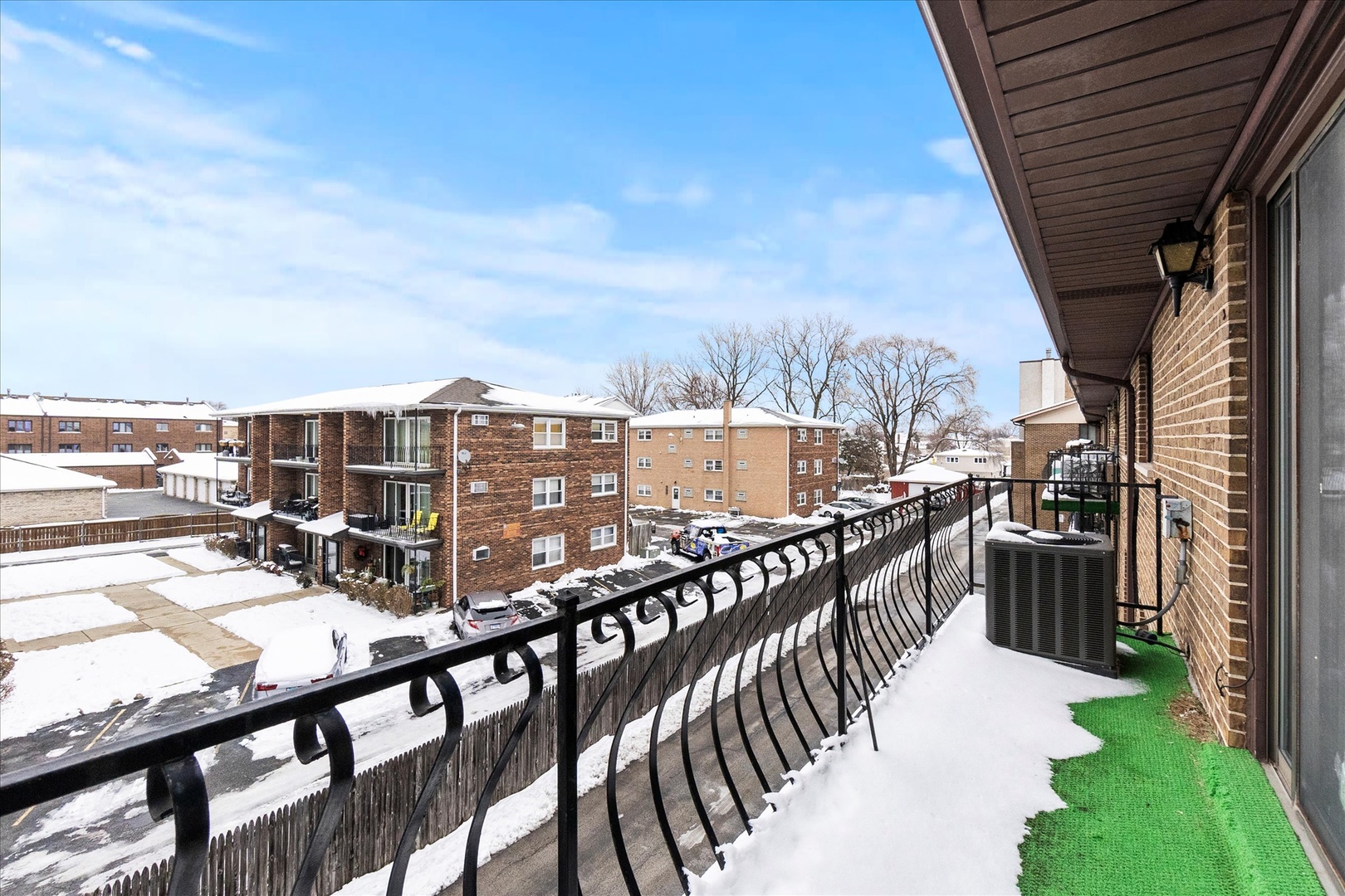 9051 South Roberts Road, Unit 310 Hickory Hills, IL 60457 - Photo 17 of 19 a view of a balcony with an ocean view