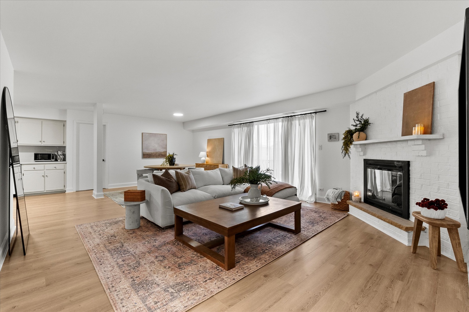 9051 South Roberts Road, Unit 310 Hickory Hills, IL 60457 - Photo 2 of 19 a living room with furniture a fireplace and a table