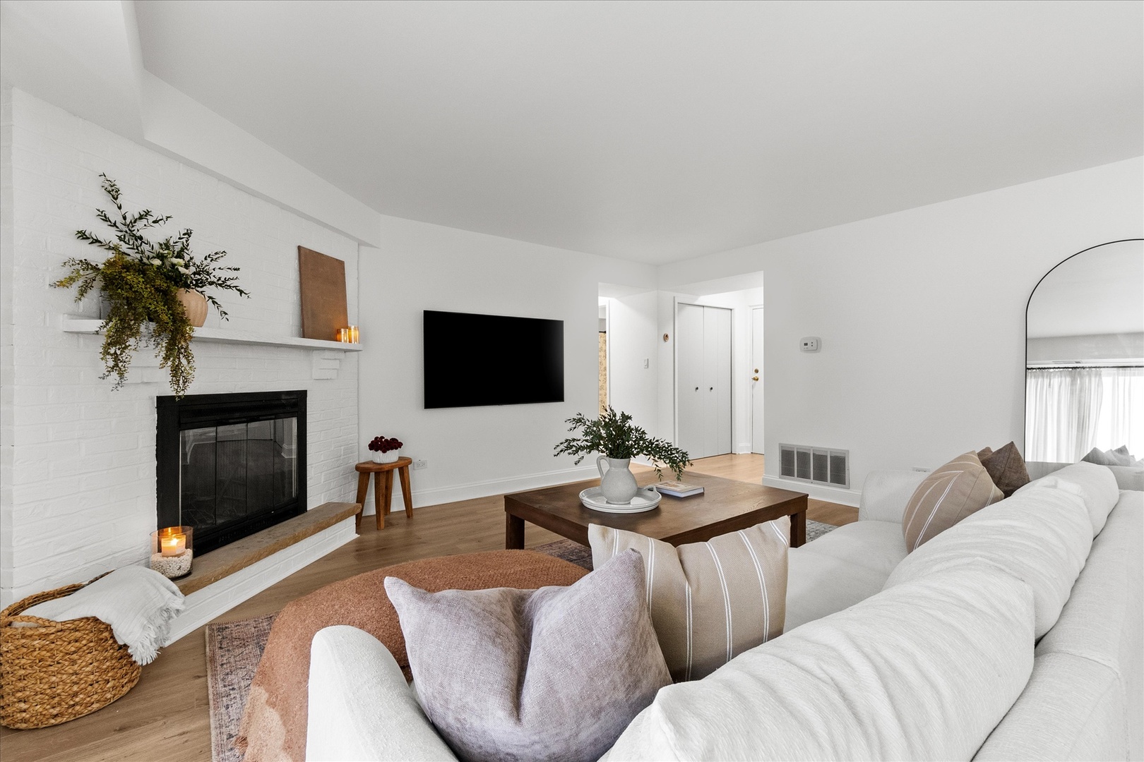 9051 South Roberts Road, Unit 310 Hickory Hills, IL 60457 - Photo 4 of 19 a living room with furniture a flat screen tv and a fireplace