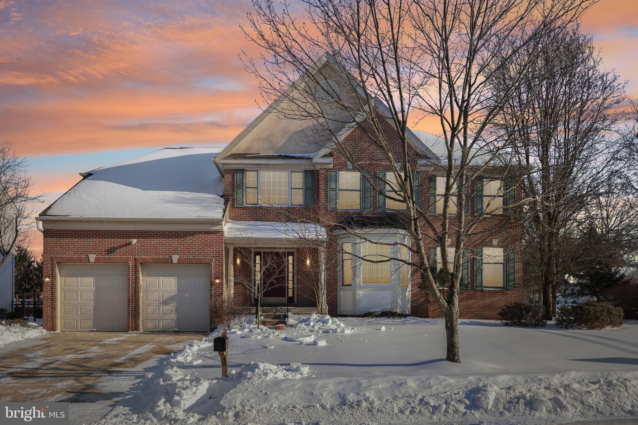 a front view of a house with yard