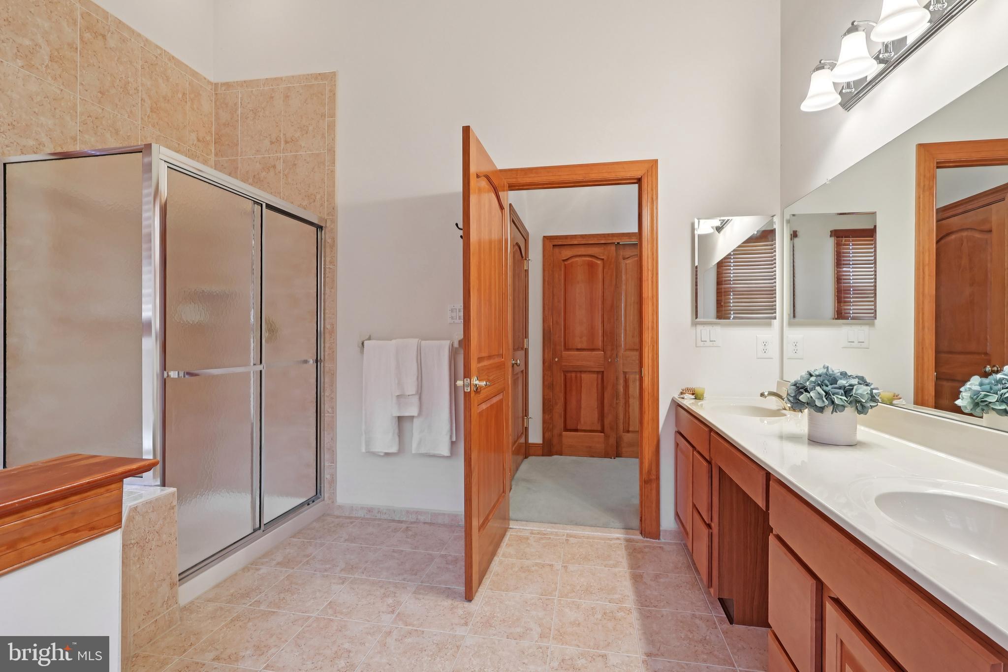 2 Kyle Court Mount Laurel, NJ 08054 - Photo 28 of 42 a spacious bathroom with a granite countertop sink and a mirror