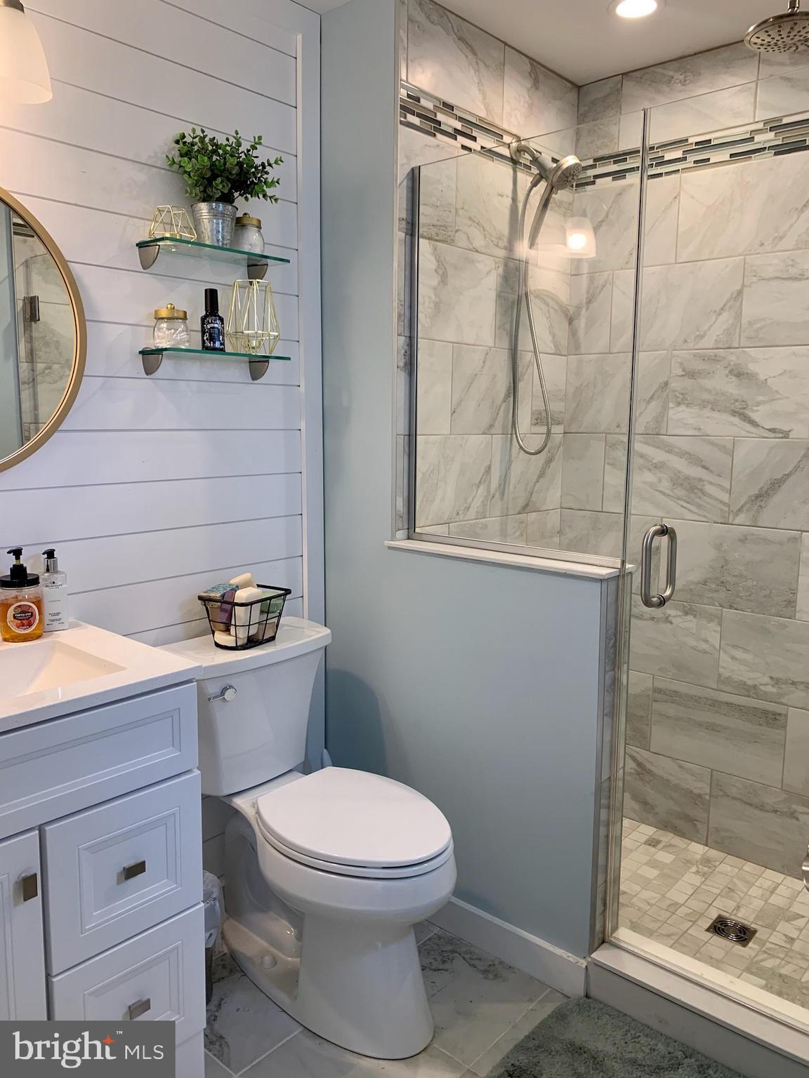 1890 Locust Road Pasadena, MD 21122 - Photo 13 of 53 a bathroom with a granite countertop sink a toilet and shower