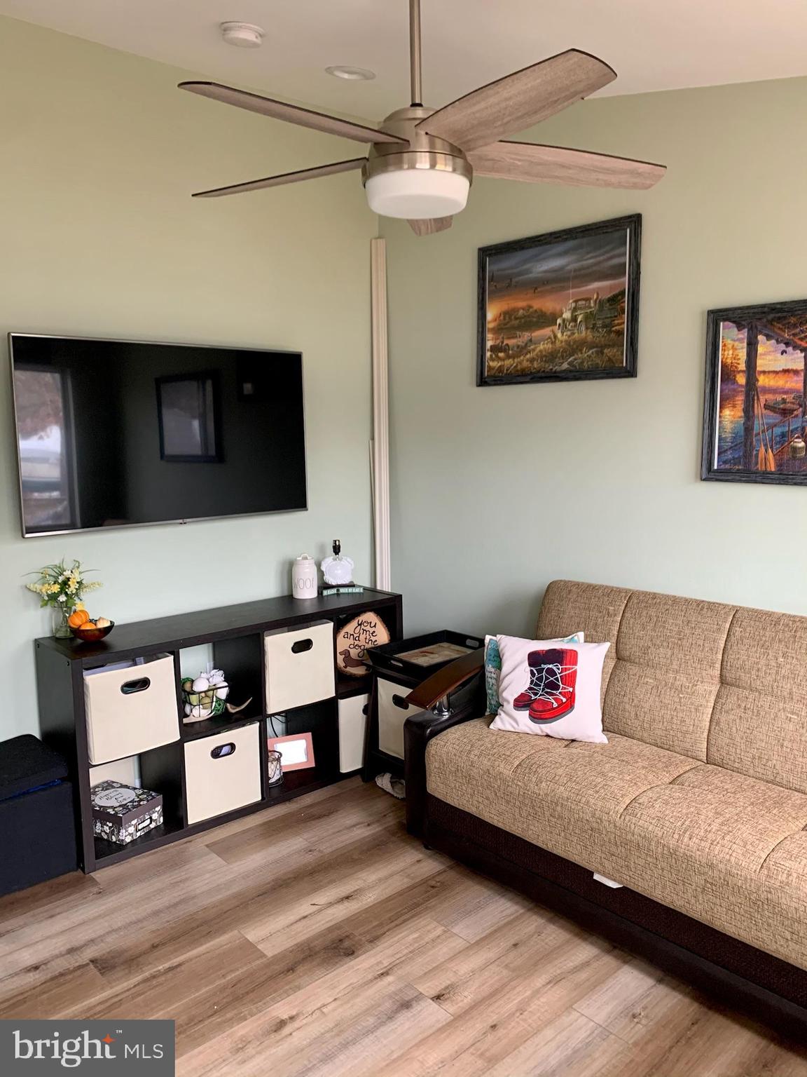 1890 Locust Road Pasadena, MD 21122 - Photo 18 of 53 a living room with furniture and a flat screen tv