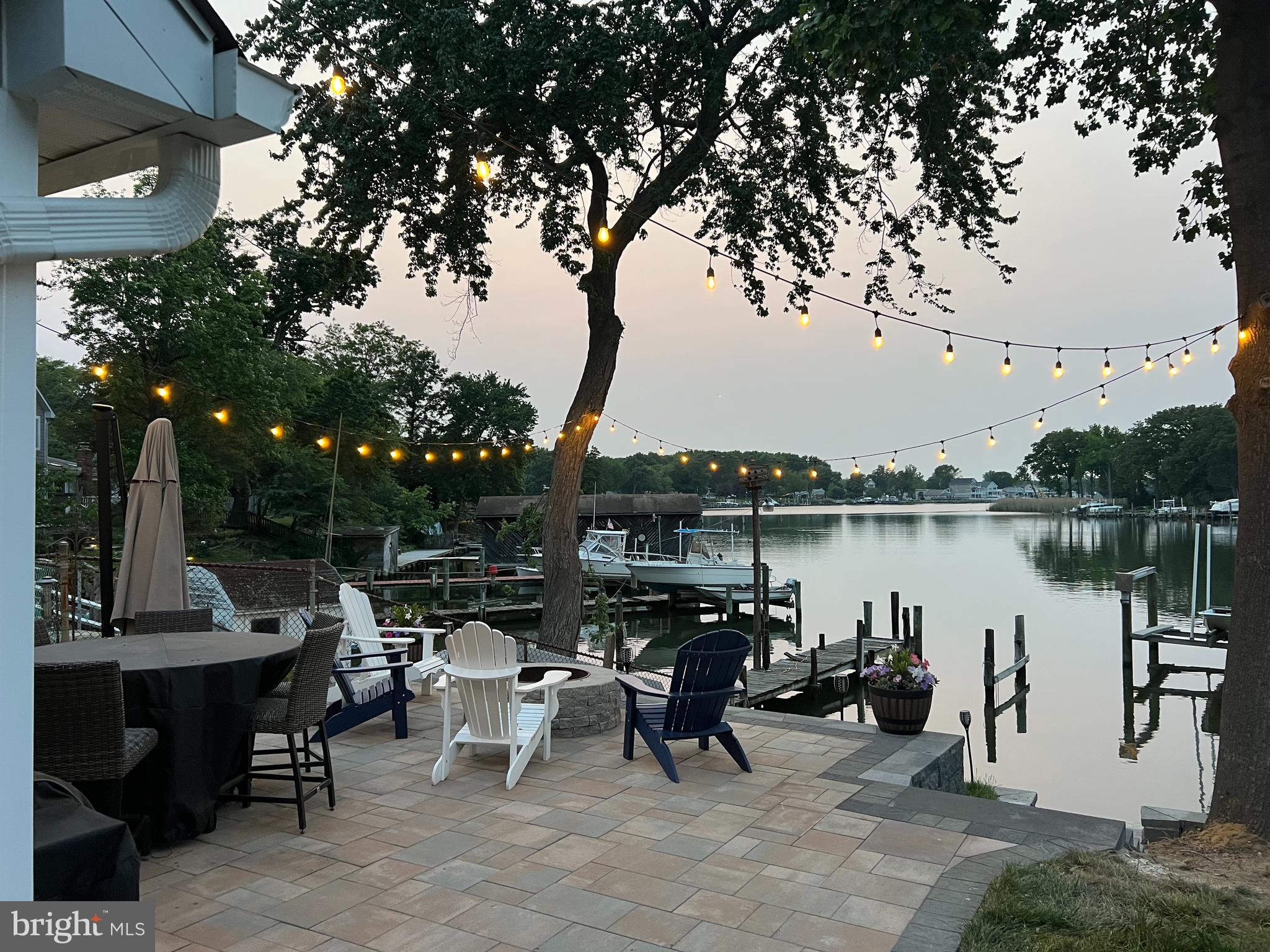 1890 Locust Road Pasadena, MD 21122 - Photo 26 of 53 a view of a lake with tables and chairs