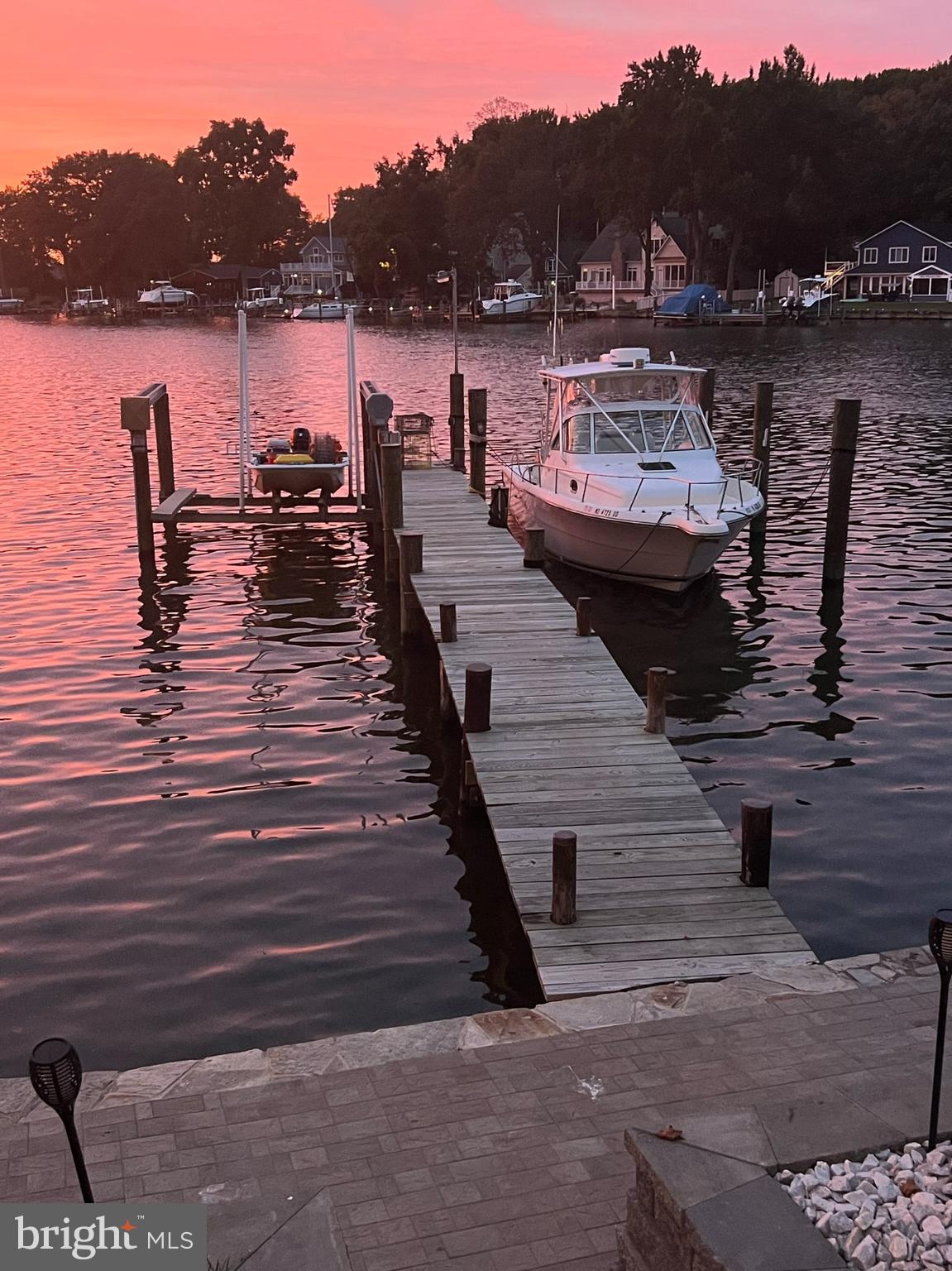 1890 Locust Road Pasadena, MD 21122 - Photo 30 of 53 a view of a lake with boats and trees in the background