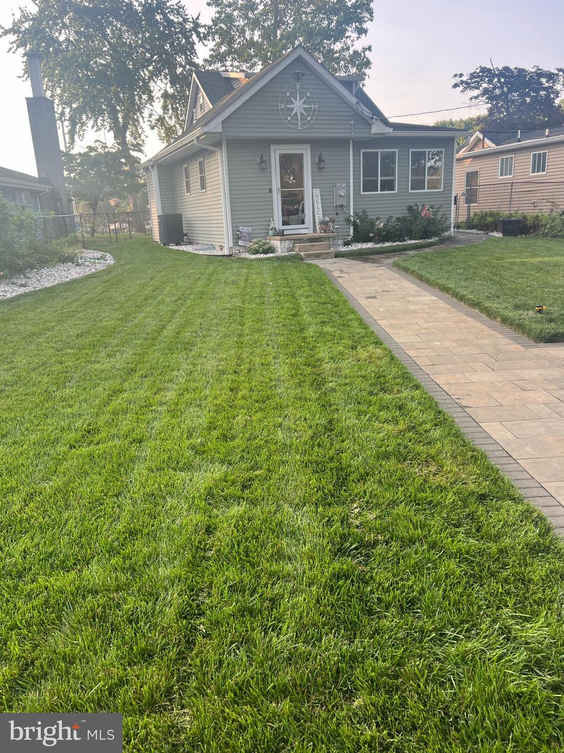 1890 Locust Road Pasadena, MD 21122 - Photo 3 of 53 a front view of a house with garden
