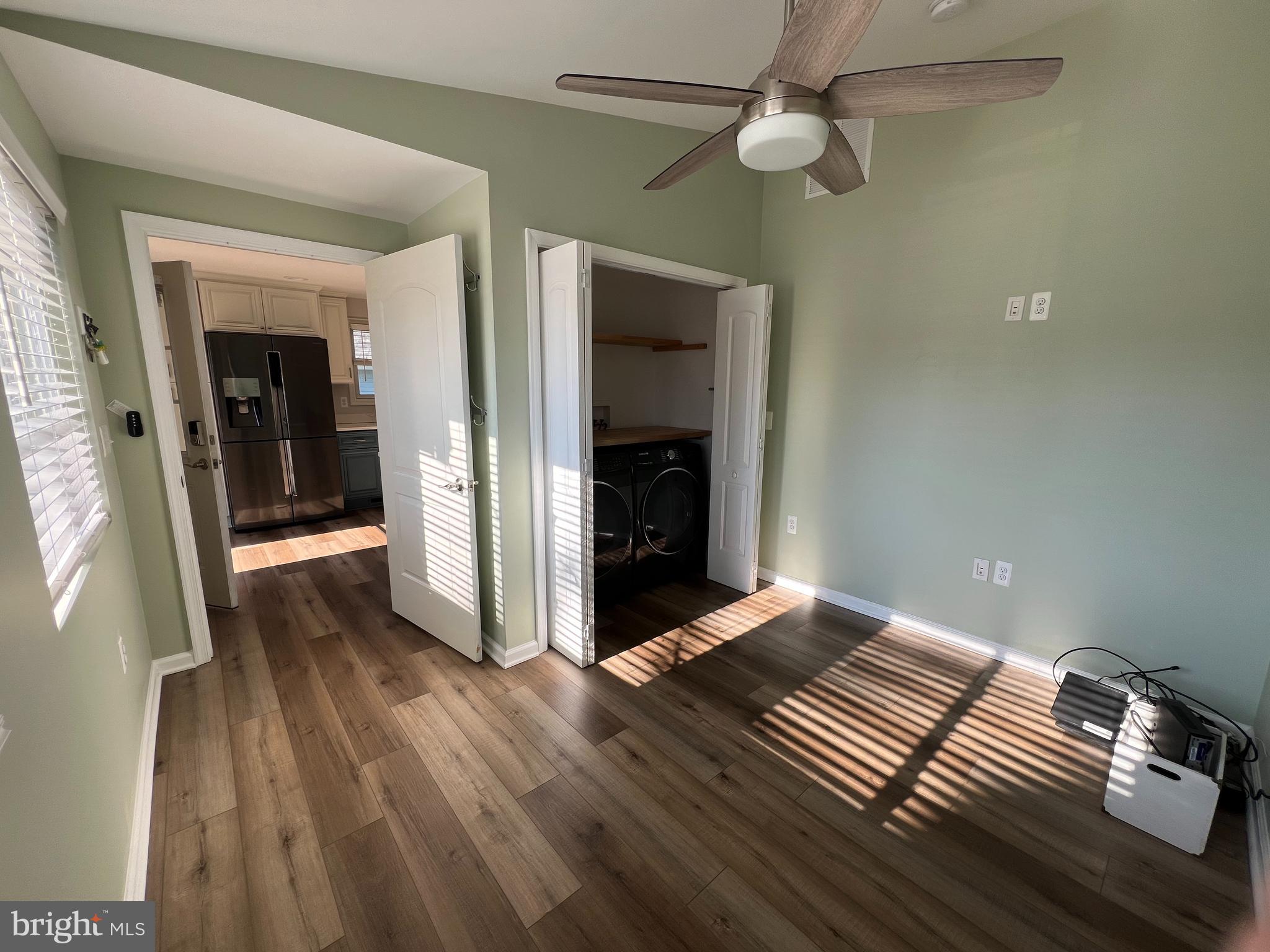 1890 Locust Road Pasadena, MD 21122 - Photo 38 of 53 wooden floor in an empty room with a window