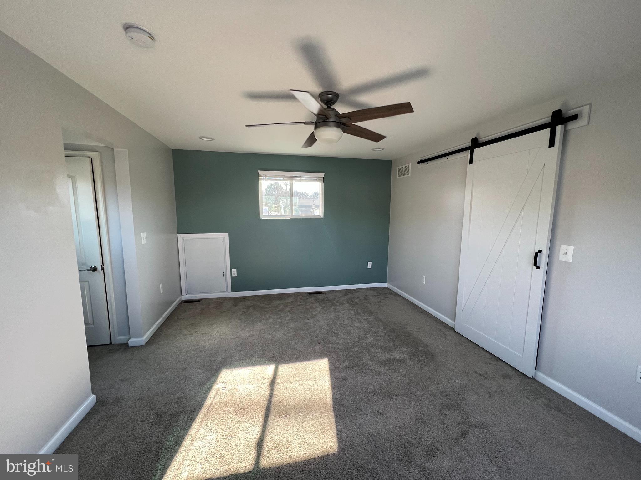 1890 Locust Road Pasadena, MD 21122 - Photo 41 of 53 a view of a livingroom with a ceiling fan and window